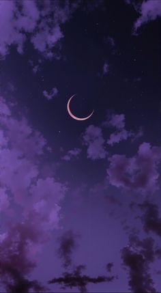 the moon is shining brightly in the night sky with purple clouds and dark blue skies