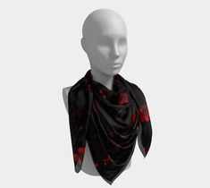 A silk scarf is the epitome of luxury when it comes to accessories. Whether you're dressing to the nines or simply adding an elevated touch, this 100% silk charmeuse scarf is sure to have you covered. Featuring red florals on a black background, the colors are vibrant and permanent, and each scarf is made to order and hand sewn for that added bit of luxury. Tie back your hair while out for lunch or wrap it like a shawl when you're out for dinner. However you use it, the silk charmeuse scarf will keep you feeling like the royalty you are. * Made from 100% silk fabric * Very soft hand, lovely drape * Print is visible about 50% on the back side * Each scarf is printed and sewn by hand in Montreal, Canada * Vivid print that will never fade after washing * Machine wash in cold water with phosph Red Satin Scarves As Gifts, Black Silk Scarves As A Gift, Flowers Dark Aesthetic, Red Dark Aesthetic, Red Silk Scarf, Flowers Dark, Red Dark, Black Thread, Montreal Canada