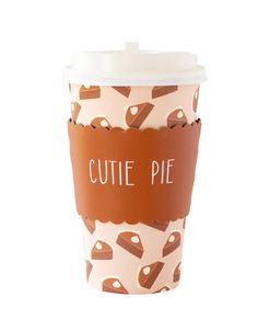 a coffee cup with some brown and white designs on it