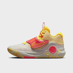 the nike zoom basketball shoe in white, yellow and pink is featured on a grey background