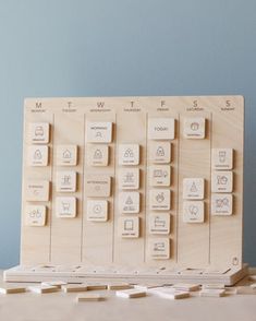 a wooden block with several different types of buttons on the front and back of it