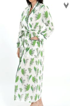 Start your day in this elegant robe for a stylish morning experience. Designed by Heidi, this robe features Lily of the Valley print - a flower that symbolizes happiness and luck is an ideal choice for you to make a classic morning statement. Unique fully scalloped trim is a sure sign of your classic style. This robe is designed to have a tailored fit . Heidi Carey Home Wear Collection #HeidiCarey Feminine Floral Print Robe For Loungewear, Spring Overnight Robe With Long Sleeves, Spring Overnight Long Sleeve Robe, Floral Print Spring Sleepwear, Spring Floral Print Sleepwear For Overnight, Floral Print Sleepwear For Overnight In Spring, White Floral Print Kimono For Loungewear, Spring Floral Print Loungewear Robe, Green Spring Robe For Loungewear