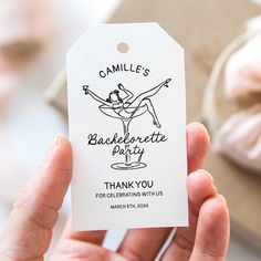 a person holding up a white gift tag with the words'bakefortette party thank you for celebrating with us '