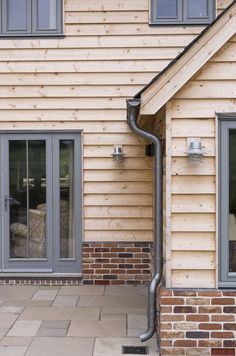 an outside view of a house with a large pipe running into the side of it