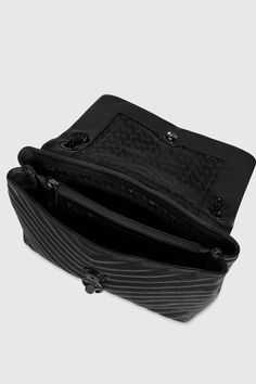 A classic in the making. The Edie Flap Shoulder bag, crafted in quilted genuine leather, toes the line between practical and glamorous. Style #: X F18MEQD37 100% Genuine Leather Black Shellac Hardware 12" W X 7" H X 3. 50" D 11-21" Strap Magnetic Snap Closure 1 Exterior Back Slip Pocket Triple Compartment with Center & Back Wall Zip Imported The photos featuring a model are for size reference only. Actual color and material may vary from what is depicted. | Rebecca Minkoff Edie Flap Shoulder Bag Black Shellac, Rebecca Minkoff Crossbody Bag, Convertible Crossbody Bag, Flap Shoulder Bag, Dog Clip, Rebecca Minkoff Bag, Quilted Crossbody Bag, Black Crossbody, Black Hardware