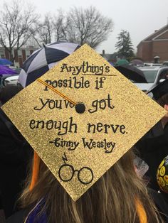 a graduation cap that says anything is possible if you've got enough nerve