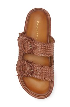 Woven leather straps crisscross over the vamp of a weekend-ready slide sandal set on a cushioned footbed and flexible outsole. Adjustable straps with buckle closures Leather upper and lining/synthetic sole Imported Brown Sandals With Woven Sole And Flat Heel, Chic Brown Slides With Leather Footbed, Brown Flat Sandals With Woven Leather, Brown Woven Leather Flat Sandals, Brown Flat Woven Leather Sandals, Chic Brown Leather Slides, Leather Footbed Sandals With Woven Sole For Vacation, Leather Footbed Sandals With Woven Sole, Leather Footbed Sandals With Woven Sole And Open Toe