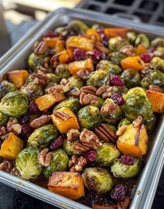 roasted brussel sprouts with pecans and cranberries in a pan