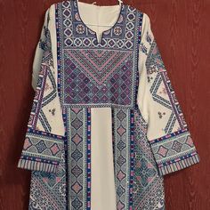 Long Sleeve. Cross Stitch Threadwork New Size Tag Looks Like A 3 But Not Sure Accepting All Reasonable Offers Thanks For Checking Out My Closet Happy Shopping Modest Long Sleeve Blue Kaftan, White Tunic Dress For Eid, Eid Multicolor Embroidered Maxi Dress, Blue Long Sleeve Thobe For Eid, Modest Long White Thobe, Blue Long Sleeve Thobe With Dabka Work, White Printed Long Sleeve Kaftan, Multicolor Long Sleeve Abaya For Eid, White Long Sleeve Thobe For Eid