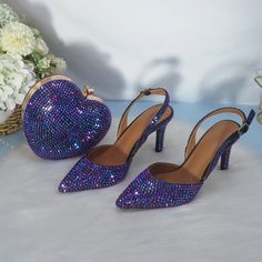 Now you will take your wedding shoes with your, leaving behind a heart shaped bag in the wedding photo booth. These are the most chic shoes while looking like you have been wearing them for years! This product is exclusive, like nobody else. With our classic wedding shoes, you can make a confident entrance on your big day. These are available in many colors and styles, so you can find exactly what you're looking for. Also, with our heart-shaped bag, you'll be able to carry your gear with 1 hand! Wedding Shoes Round Toe For Party Season, Wedding Shoes With Round Toe, Round Toe Wedding Shoes For Party Season, Round Toe Heels For Wedding And Party Season, Wedding Heels For Party Season With Round Toe, 4-inch Heels For Wedding And Party Season, Ankle Strap Wedding Shoes For Party Season, Purple Wedding Shoes For Party, Glamorous Wedding Heels For Party Season