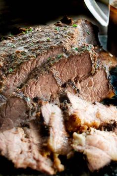 a close up of sliced meat on a plate