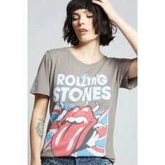 The Rolling Stones - Est. 1962 The Rolling Stones - Est. 1962 T-shirt is a must-have for any fan! Show off your rock 'n' roll style with the iconic band's name, lips and tongue logo, Union Jack flag, and founding year. The vintage steel gray tee is perfect for a casual, edgy look. Fit: Soft cotton fabric. Loose crew neckline. Distressed edges. Raw cut bottom hem. Model is wearing a size small. Model height is 5'7". Material: 100% Cotton Rolling Stones Tee, Jack Flag, Union Jack Flag, Diva Boutique, Boyfriend T Shirt, Grey Tee, Boyfriend Tee, The Union, Edgy Look