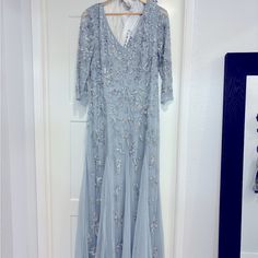 Blue Beaded Long Dress With 3/4 Sleeves. Oleg Cassini, Size 16 (Runs A Bit Small). Will Need To Be Dry Cleaned. Light Blue Embellished Floor-length Dress, Elegant Embellished Light Blue Evening Dress, Elegant Light Blue Embellished Evening Dress, Blue Embellished Evening Dress For Spring, Elegant Light Blue Sequin Dress, Embellished Light Blue Formal Dress, Embellished Light Blue Dress For Formal Occasions, Elegant Blue Embellished Mother Of The Bride Dress, Blue Beaded Formal Dress