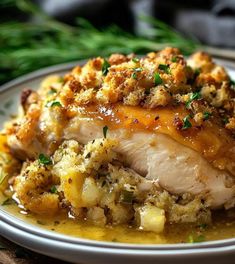 a white plate topped with meat covered in gravy