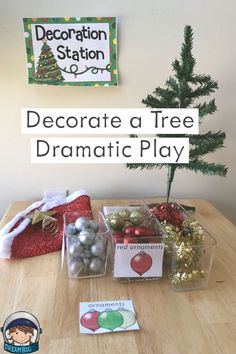 a christmas tree with ornaments and decorations in plastic containers on a table next to a sign that says decorate a tree dramatic play