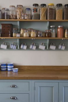 the shelves are filled with many different types of spices