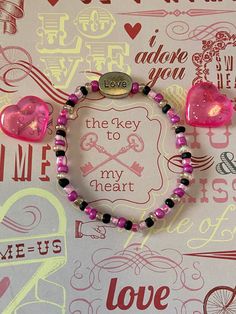 This is a Valentine beaded bracelet. It would make a great gift for a teen girl for Valentines Day. It would also make a great gift for a teen girl's Birthday. It has a silver love bead in the middle. It has black, hot pink, pink, and clear seed beads. It was made with .8mm sturdy stretch string. I tie it several times to prevent breakage. It fits most teens. It stretches to fit on the wrist. All items are ready to be shipped I do combined shipping. Items ship in 2-5 business days. Check out mor Teen Valentine Gifts, Bracelet Love, Seed Bead Bracelet, Love Bracelet, Black Hot Pink, Seed Bead Bracelets, Love Bracelets, Pink Pink