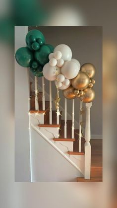 balloons are on the banisters as well as stars and sparklers in gold, white and green