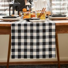 the table is set with black and white checkered cloth