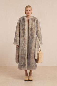 A sumptuous long sleeve faux fur coat with adjustable waist tie. — Faux fur — Collarless — Long sleeve — Waist tie White Long Fur Coat, Long Fur Coat, Evening Flats, Sandal Platform, Swimming Bag, Candle Collection, Kids Sandals, White Summer, Baby Winter