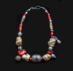 Old Turkmen Silver Bead, Huge Cut Vintage Conch Shell, Yemenite Jewish Bulbous Pendant, Old Turkoman Bell and Dangle, Yemeni Silver, Red Coral, Dzi Beads. The center bead is a large Turkman bead that is 40-60 years old. It is approx. 29mm x 39mm, displaying amazing patina and age. There are several dents on one side. Please see photo. On the flank of this vintage Turkman bead are 2 small red coral beads and four natural old twisted conch beads. These beads are organic with amazing textures and c Moroccan Jewelry, Conch Shell, Silver Bead, Coral Beads, Red Coral, Design Tips, Conch, Silver Beads, Jewelry Art