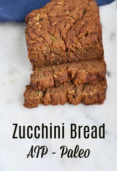 a loaf of zucchini bread on top of a white counter with text overlay