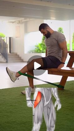 a man sitting on top of a wooden bench