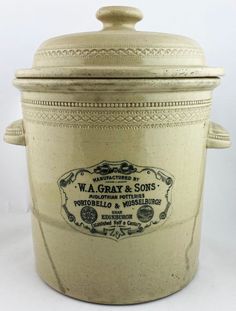 an old fashioned ice bucket with the label w a gray & sons on it's lid