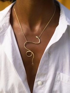 Our serpent necklace is hand forged out of bronze or sterling silver. This versatile necklace can be worn two ways. Simply slide the chain along the body of the snake to change it's hanging position. It drapes from gold filled or silver chain so effortlessly. Snake Shape Necklace With Adjustable Chain, Minimalist Gold Snake Necklace, Elegant Snake Clavicle Chain Necklaces, Elegant Snake Shape Necklaces With Clavicle Chain, Elegant Sterling Silver Snake Necklace, Unique Adjustable Snake Chain Necklace, Minimalist Snake Shape Necklace With Adjustable Chain, Minimalist Snake Chain Necklace With Adjustable Chain, Unique Gold Snake Necklace