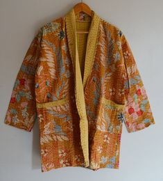 kantha Quilted Jacket,bathrobe/kimono Indian Handmade Kantha Coat Jacket, Women Wear bath robe, Comfortable For Winter Wear Women Kimono Jacket A beautiful Kantha Handwork Quilted Kimono This multipurpose piece can be worn as a layering piece over a tee with jeans, as an open kimono, a beach cover up or a robe. FABRIC = 100 % cotton hand screen printed with hand kantha quilting Colour - Yellow SIZE - US WOMEN LETTER (All Size ) MEASUREMENT OR SIZES S Size Kantha Jacket Length: 30 Inches Chest : Long Sleeve Cotton Kimono For Fall, Cotton Long Sleeve Kimono For Fall, Cotton Patchwork Long Sleeve Kimono, Long Sleeve Cotton Kimono With Patchwork, Long Sleeve Cotton Patchwork Kimono, Traditional Yellow Outerwear For Fall, Traditional Yellow Fall Outerwear, Traditional Yellow Outerwear For Spring, Traditional Orange Long Sleeve Outerwear