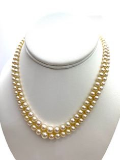 "Akoya Necklace with a 14 karat white gold clasp. Near round, cream color with pink overtone pearls. GIA certified, certificate shown in picture. One hundred fifty-four (154) drilled pearls in a graduated double strand necklace with a white metal clasp marked \"14KS\" and set with one transparent near-colorless round brilliant: Strand 1) 74 pearls Strand 2) 80 pearls. 33.90 grams (gross) Pearls ranging from 3.52 mm to 8.36 x 8.16 mm We ship within 1 day of receiving your order from Hawaii by fir Luxury Akoya Pearl Beaded Necklace, Classic Pear-shaped Pearl Necklace, Classic White Gold Pearl Necklace In Pear Shape, Classic Cream Pearl Necklace With Pearl Charm, Classic Cream Pearl Chain Necklace, Classic Cream Round Beads Jewelry, Classic Pear-shaped Pearl Necklace For Formal Occasions, Classic Cream Round Bead Jewelry, Formal Single Strand Cream Pearl Necklace