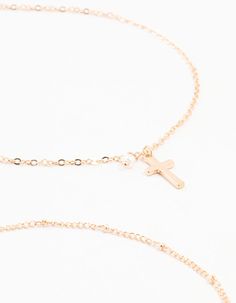 Embrace the choker trend in an elegant way with this set of three gold toned chokers. This set features classic sleek chain styles for a dainty look and also includes a delicate cross pendant for adding charm. Perfect for adding minimalistic glam. Dimensions: Chain Length: 28 cm Extender: 8 cm | Lovisa Gold Ball Chain Cross Chokers 3-Pack Gold Ball Chain, Cross Choker, Ball Chain, Chain Styles, Chain Lengths, Cross Pendant, Chain Length, Choker, Gold Tones