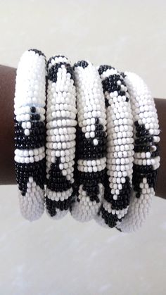 Bracelets | Custom Bracelets | Mother's Gift | Gift Idea | Bangles | Unique Gift | Bracelets For Women | Yoga Bracelets | Daughters Gift These superbly crafted Zulu beaded bracelets are made of fine beads which can be worn in any occasion. Color - White and black. Feel free to send me a convo or e-mail for any clarification. Thank you for visiting... Adjustable Beaded White Bangle, White Beaded Bangle With Round Beads, Adjustable White Beaded Bangle, White Bohemian Bangle Wristband, White Bracelets With Black Beads, White Bracelets With Round Black Beads, Traditional White Round Beads Stretch Bracelet, Traditional White Round Bead Stretch Bracelet, Traditional White Stretch Bracelet With Round Beads