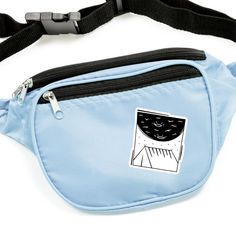 a blue fanny bag with a yellow cat sticker on it