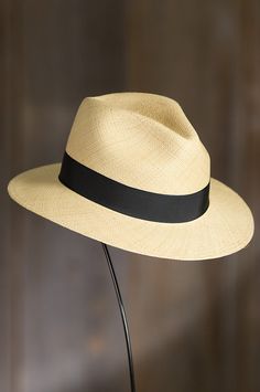 Our dapper panama is poised for sunny days. Made of 100% panama straw from Ecuador, this timeless safari features a 1" grosgrain ribbon finished with a bow and pin, and a 2.5" brim for shade and style. This warm-weather favorite has a twill interior sweatband that ensures comfort and fit. Made in the USA. Fur Hats, Safari Hat, Men's Hats, Western Hats, Women's Hats, Cool Hats, Handbag Shoes, Womens Clothing Stores, Earmuffs