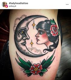 a woman's face and crescent moon tattoo on the thigh, with flowers around it