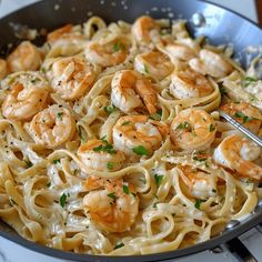 pasta with shrimp and parsley in a skillet