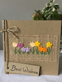 a card with flowers on it and the words best wishes