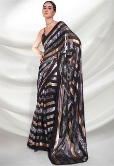 Faux Georgette Saree in Black This drape is Enhanced with Sequins Work Available with an Unstitched Art Silk Blouse in Black Do note: Accessories shown in the image are for presentation purposes only. (Slight variation in actual color vs. image is possible). Indian Party Wear Dresses, Saree In Black, Blouse Details, Latest Indian Saree, Designer Sarees Collection, Latest Designer Sarees, Indian Party Wear, Party Wear Saree, Indian Sarees Online