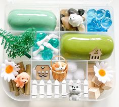 a plastic container filled with different types of toys