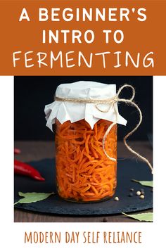 a jar filled with carrots sitting on top of a table