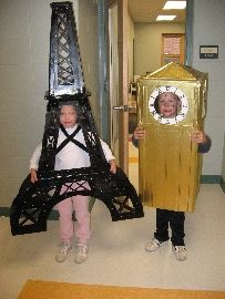 two children wearing costumes made to look like the eiffel tower