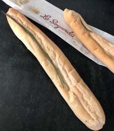 two long loafs of bread sitting next to each other