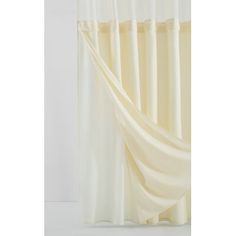 a white curtain hanging on the side of a wall