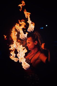 a woman with fire in her hands