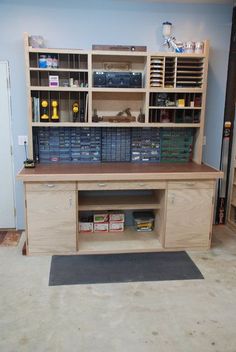 an unfinished workbench with lots of drawers and shelves