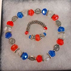 Handmade Bracelet And Beaded Stretch Ring Perfect For The 4th Of July Or Attending Patriotic Events, Or Just Because! Handmade By Me, Both Are Stretchy. Ring Can Fit A Size 5 Thru 8. If Your Finger Ranges Are 9,10,11 Or More, Let Me Know, And I Will Make One To Fit. I Will Add A Few Extra Beads. Clean, Smoke-Free Home! Fast Shipping! Fair Offers Accepted! May Use Recycled Or Reused Boxes, Mailers, And Packing Materials.Are You Brand New To Poshmark? If So, Please Sign Up Today And Use Code Karey Handmade Adjustable Patriotic Bracelets, Handmade Adjustable Patriotic Bracelet, Patriotic Handmade Adjustable Bracelets, Patriotic Round Beads Jewelry Gift, Patriotic Blue Jewelry With Colorful Beads, Patriotic Blue Round Bead Jewelry, Adjustable Patriotic Jewelry With Colorful Beads, Patriotic Adjustable Colorful Beads Jewelry, Patriotic Jewelry With Colorful Beads As Gift