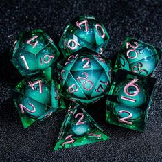 green and pink dices with numbers on them