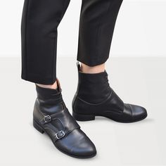 "These edgy combat boots with flap, two silver-toned buckles and laces for fastening are made for a polished androgynous look. These smart pair made from classic black leather will allow you to move from official day duties to eve vibes effortlessly. Outer and inner material - leather, closure - lace & buckle, heel 2.5 cm / 1.0\" --------Size Conversion & Feet Measurements------- EU 34 US 4.0 UK 1.0 | 22.5 cm / 8.85\" EU 35 US 5.0 UK 2.0 | 23.0 cm / 9.05\" EU 36 US 6.0 UK 3.0 | 23.5 cm / Black Moto Boots With Buckle Closure For Business, Black Cap Toe Moto Boots For Fall, Punk Style Leather Lace-up Boots With Buckle Closure, Black Ankle Lace-up Boots With Buckle Closure, Black Lace-up Ankle Boots With Buckle, Black Boots Leather, Womens Fall Boots, Silver Decorations, Strap Boots