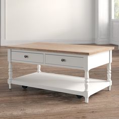 a white coffee table with two drawers on it